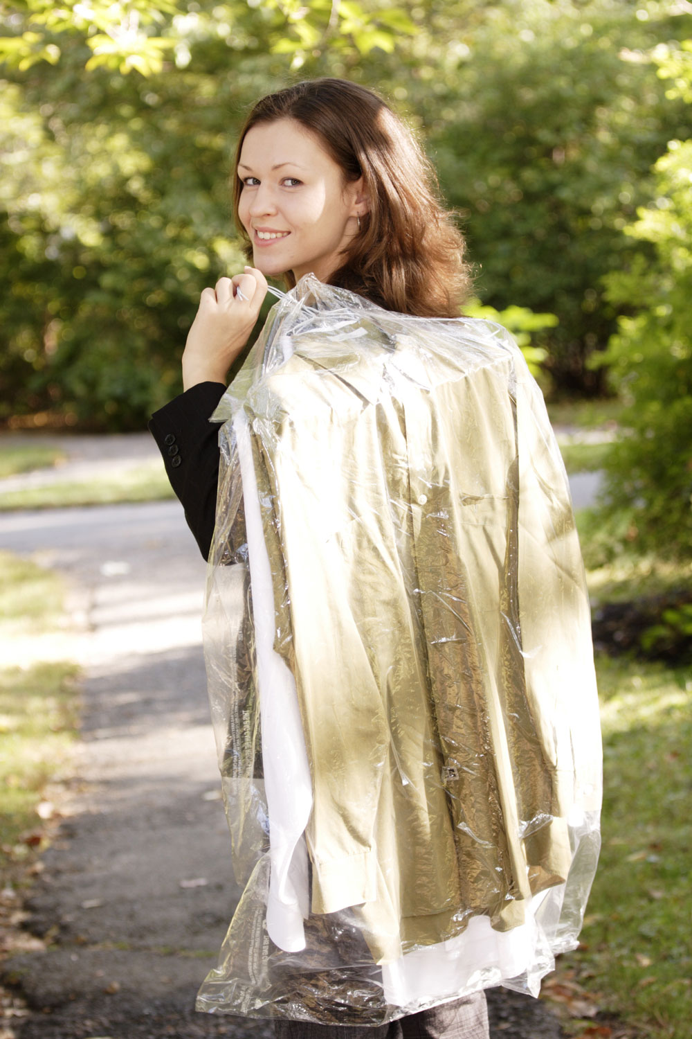 women picking up drycleaning